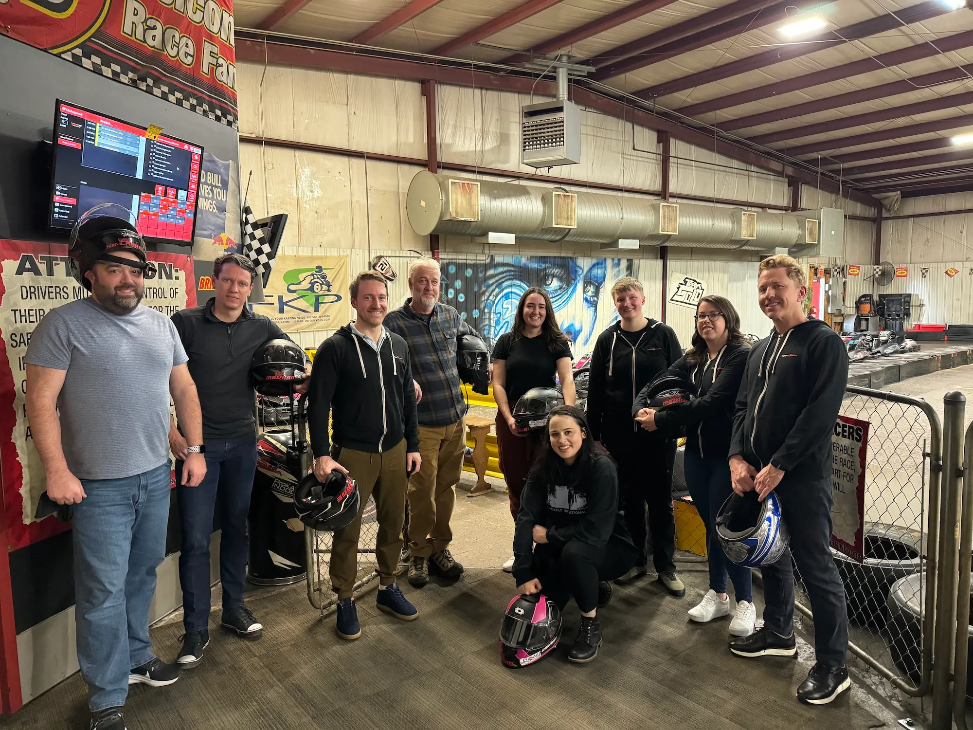 Many Frontend Masters team members enjoying a go-kart racing event